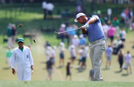 Bryson DeChambeau hits his approach shot on the 1st.