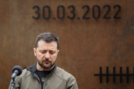 Volodymyr Zelenskiy pauses as he speaks during a visit to the village of Yahidne.